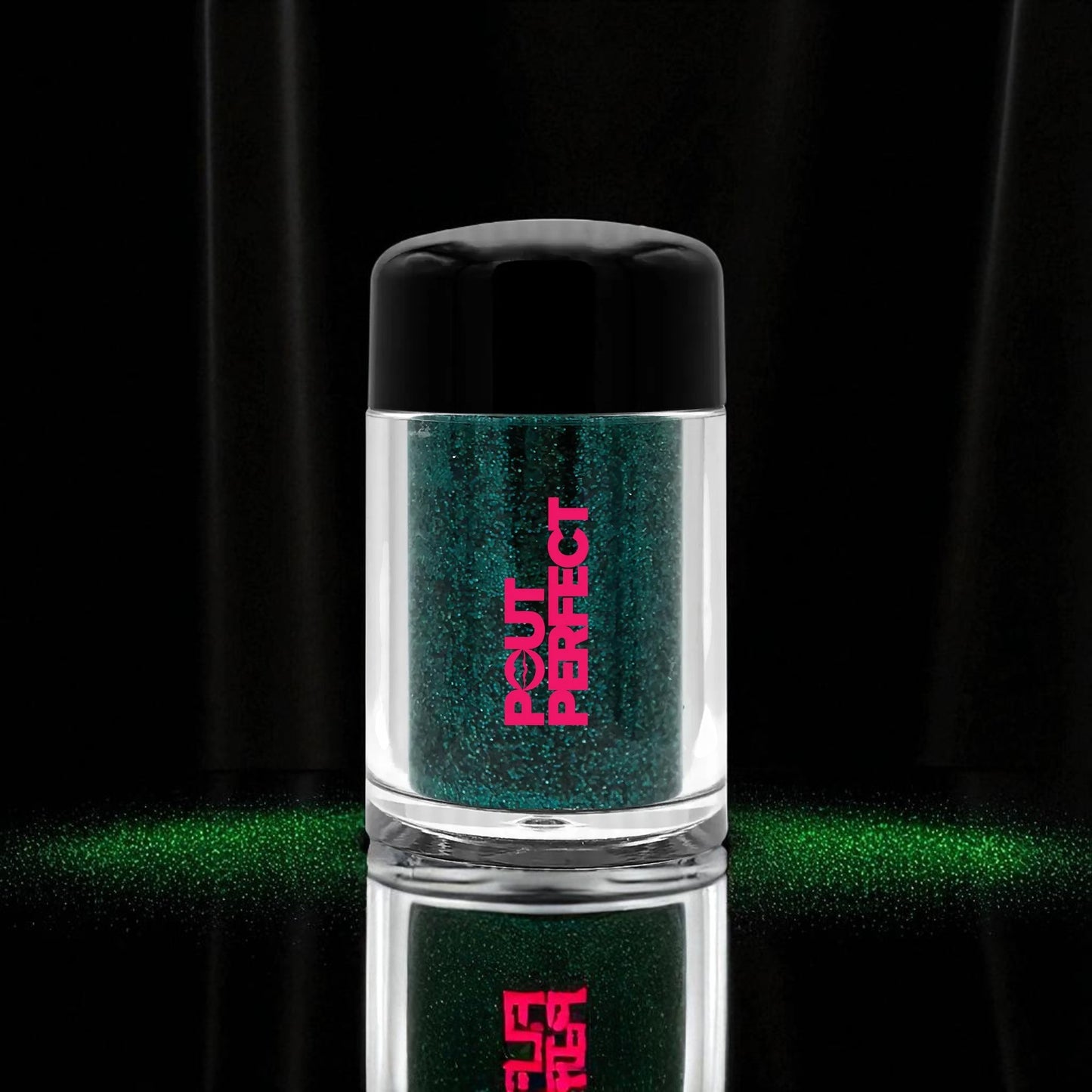 Pout Perfect aquamarine glitter lip dust in clear container with black lid on black background