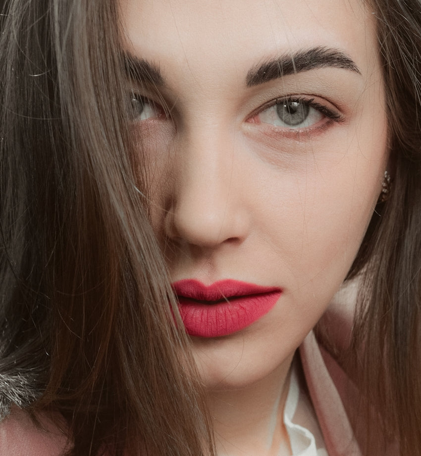woman in red lipstick and white shirt