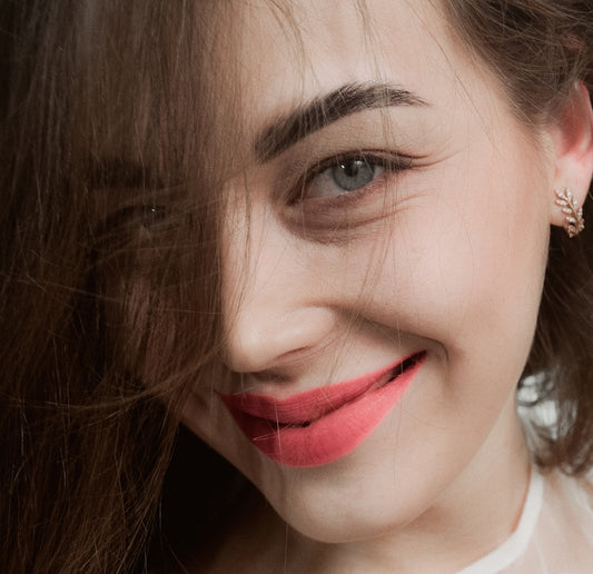 woman in white shirt with red lipstick