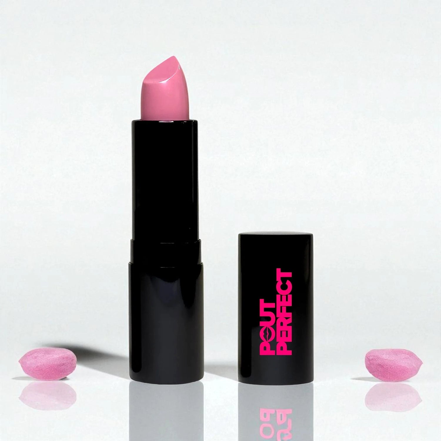 Luxury cream lipstick in a sleek black tube with pink shade and matching black cap