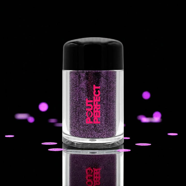 Pout Perfect amethyst glitter lip dust in clear jar with black lid against black background