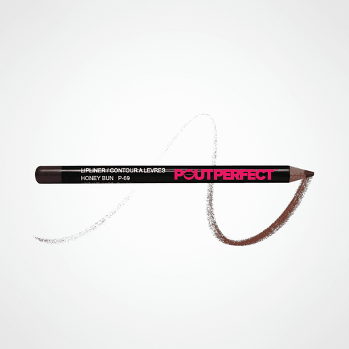 A Pout Perfect lip liner pencil in the shade Honey Bun, shown horizontally on a clean white background with a textured swipe of the brown lip color behind it. Honeybun