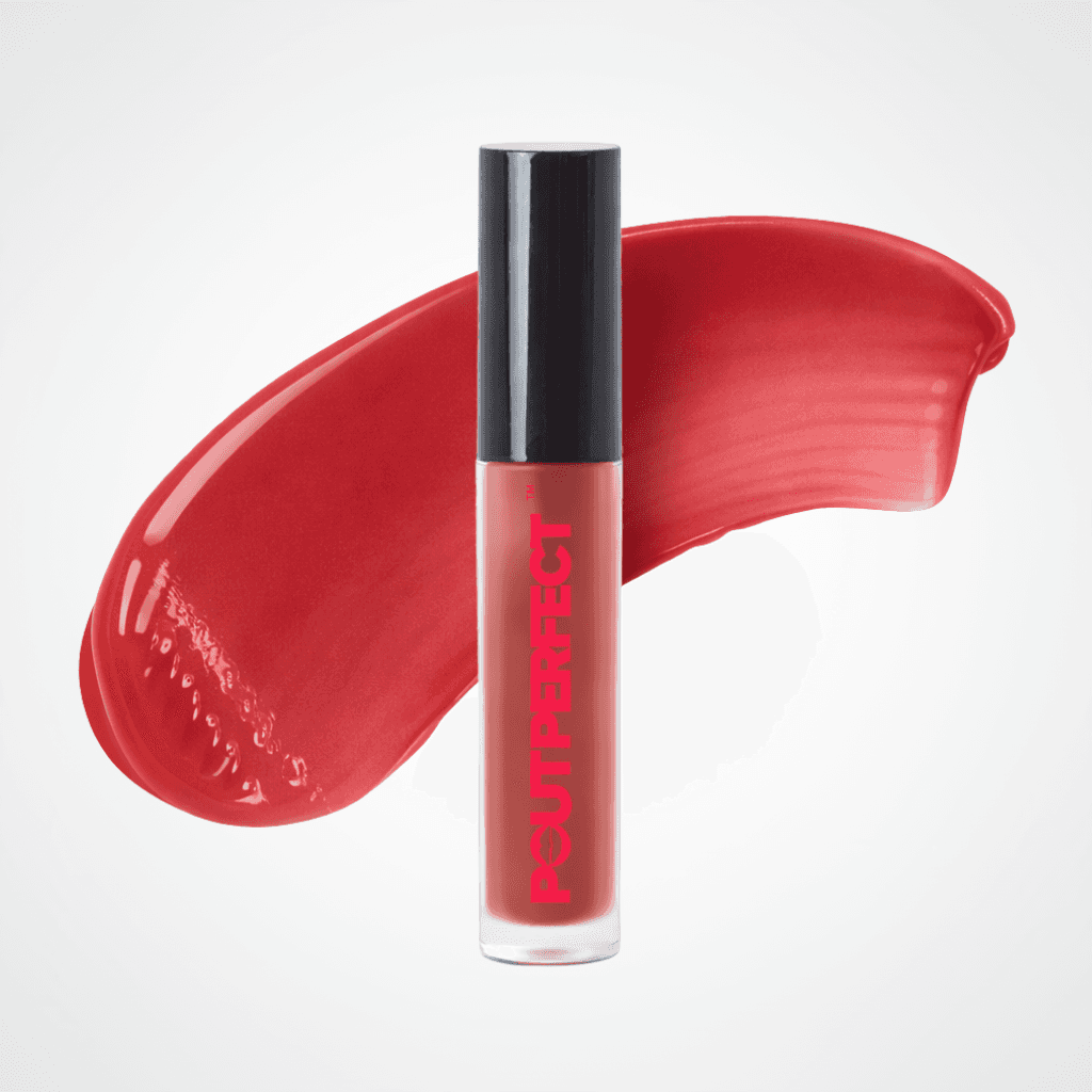 A tube of Pout Perfect liquid lipstick in a vibrant red shade, standing upright in front of a matching glossy red color smear on a light gray background. Warm Rose