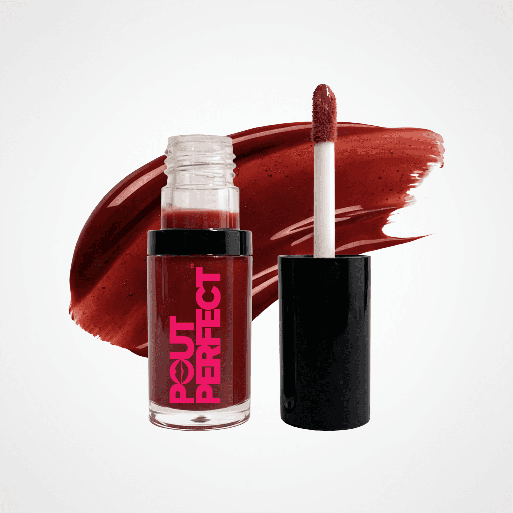 A bottle of Couture Perfect liquid lipstick with its cap off, showing the applicator wand with product on it, set against a white background with a large swipe of the deep berry-red lipstick color. Rosewood