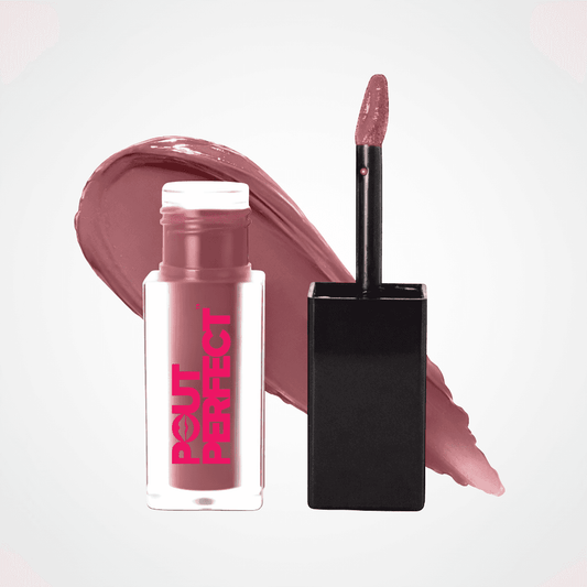 A bottle of Bout de Perfect liquid lipstick with a black applicator wand, shown next to a large swipe of the dusty rose pink formula on a clean white background. Blackberry Wine