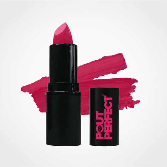 A black lipstick tube with a bright pink lipstick bullet standing upright, alongside its matching black cap printed with the brand name 'POUT PERFECT' in pink. A textured pink lipstick swatch is painted in the background on a clean white studio backdrop. Fuchsia Fever
