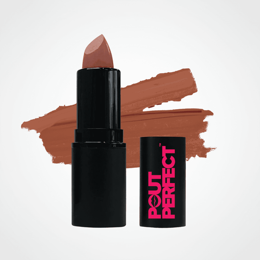A black lipstick tube with a nude pink lipstick bullet standing next to its matching black cap, which features pink 'POUT PERFECT' branding. A warm brownish-terracotta makeup swatch is painted in the background on a clean white studio backdrop. Moxie