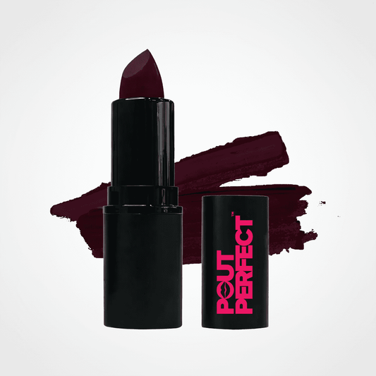 A black lipstick tube with a deep burgundy lipstick bullet, shown next to its matching black cap featuring a hot pink 'OUT PERFECT' logo. A textured burgundy lipstick swatch is displayed behind the products on a clean white background. Shiraz