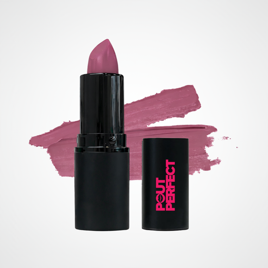A black lipstick tube with a pinkish-purple lipstick bullet standing upright, shown next to its matching black cap with pink 'OUT PERFECT' branding, set against a white background with a mauve lipstick swatch behind it.