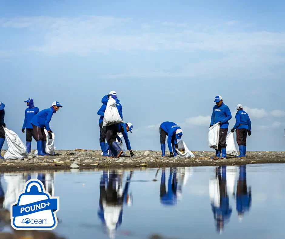 Ecodrive team collecting trash on shore as part of ocean plastic removal services cleanup effort