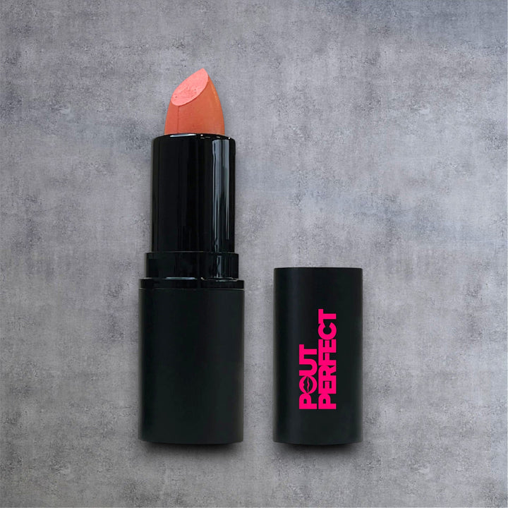 Pout Perfect barely beige lipstick with black tube and pink logo on gray background