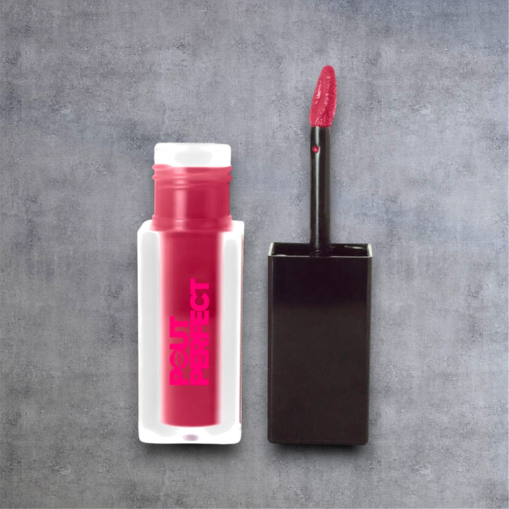 Pout Perfect deep burgundy matte lip stain with applicator wand on gray background