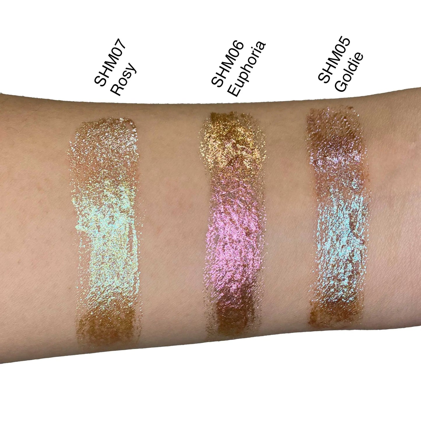 Pout Perfect liquid shimmer swatches on arm featuring gold shimmer lip makeup shades Rosy Euphoria and Goldie