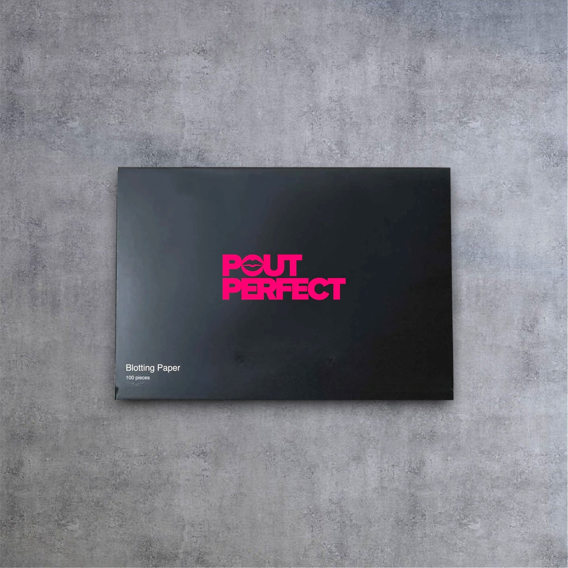 Pout Perfect luxury blotting papers for lips in a sleek black rectangular package with pink logo