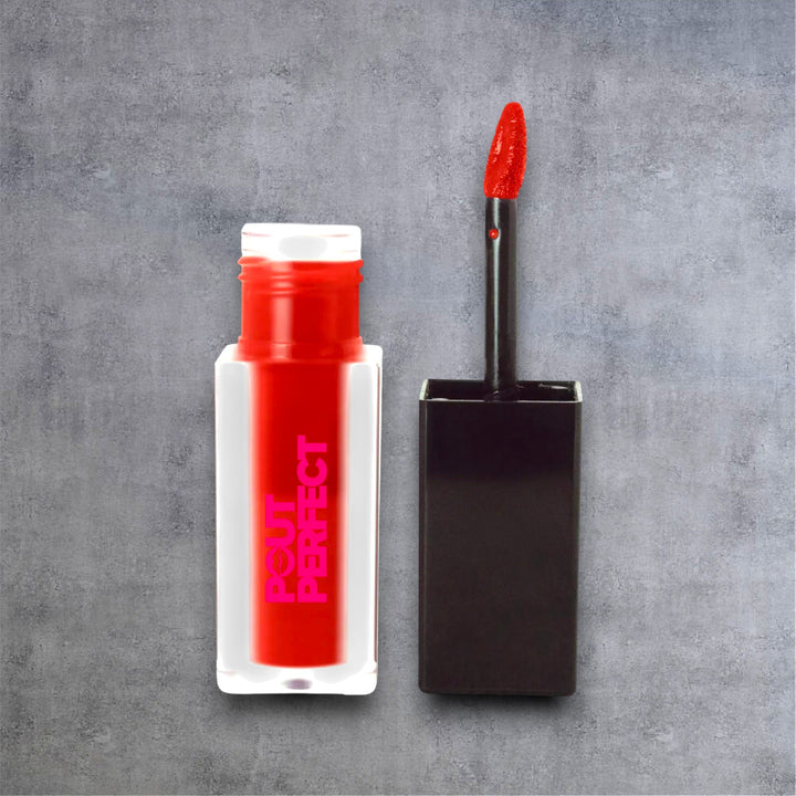 Pout Perfect matte lip stain true crimson with applicator wand against gray background