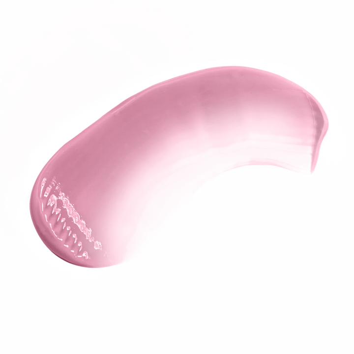 Pink lip kit swatch by Pout Perfect showing smooth creamy texture on black background