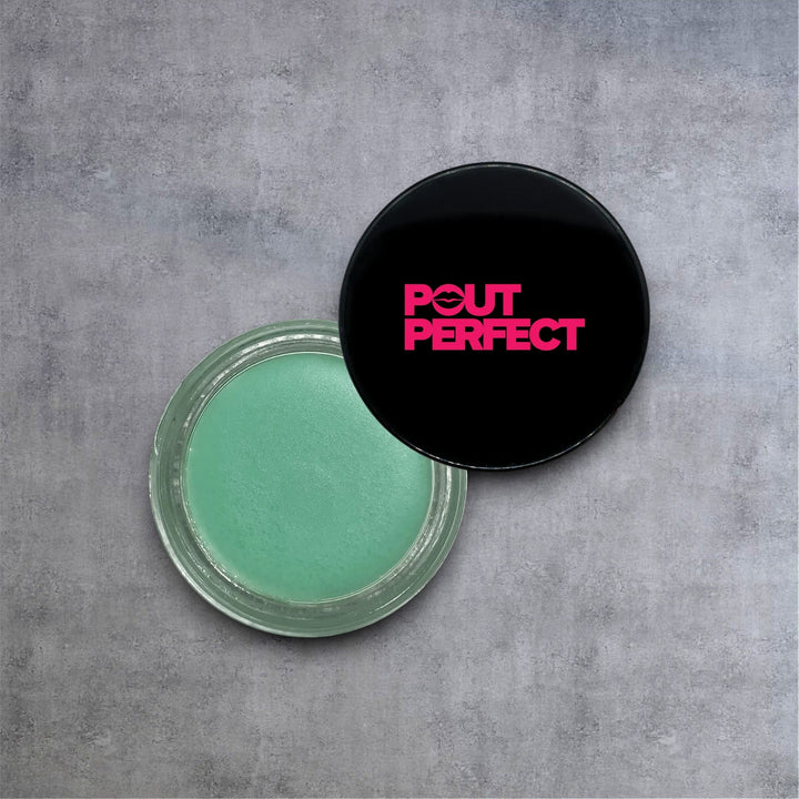Pout Perfect sugar mint lip scrub in a clear jar with black lid on gray background