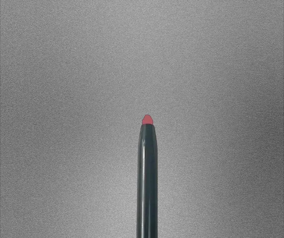 Pout Perfect automatic lip liner pencil with a sharp pink tip on a gray background