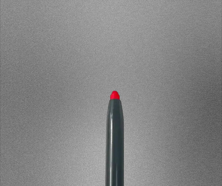 Pout Perfect scarlet automatic lip liner with bright red tip on gray background
